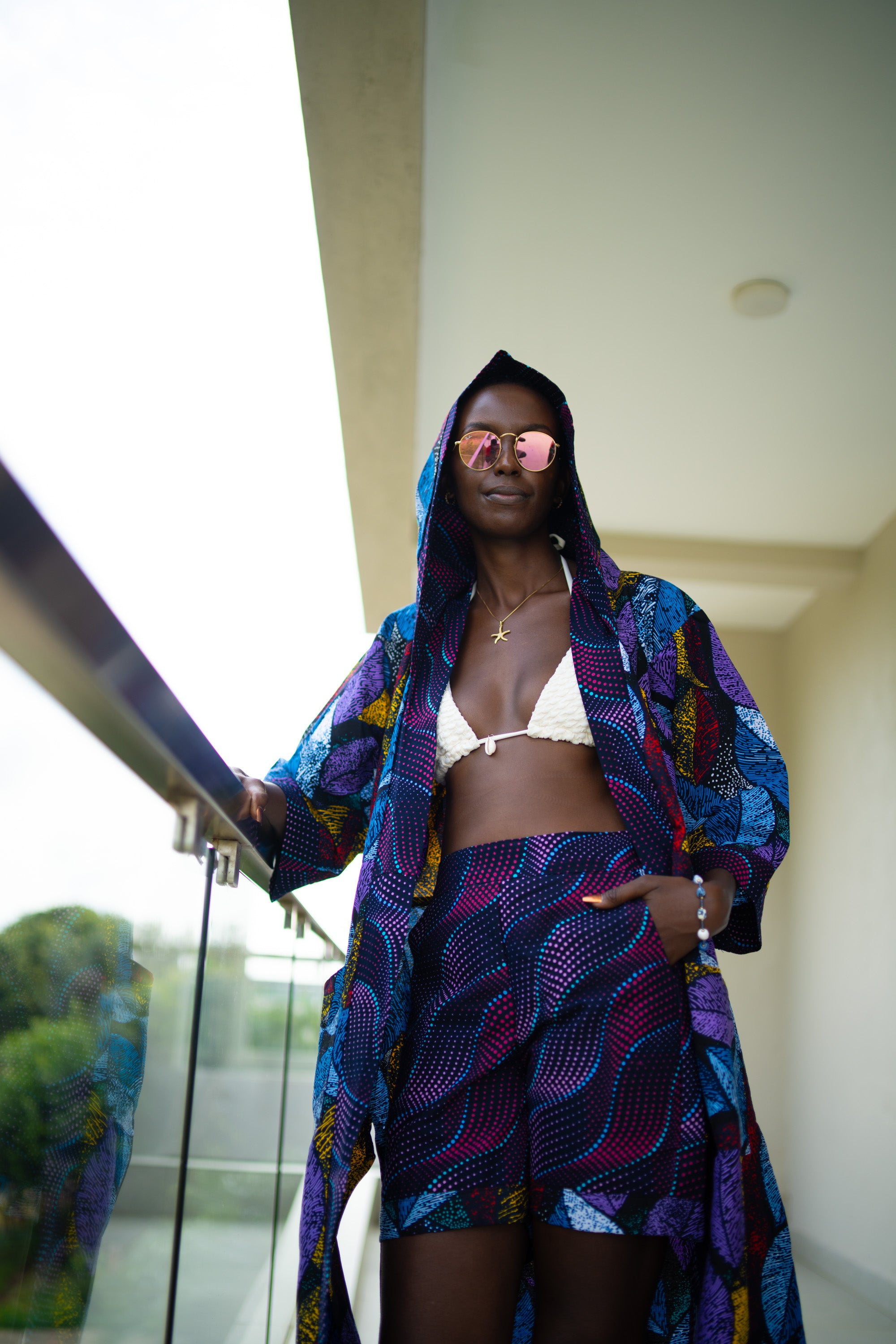 Woman wearing Midnight Garden African cover-up and shorts set in midnight floral print