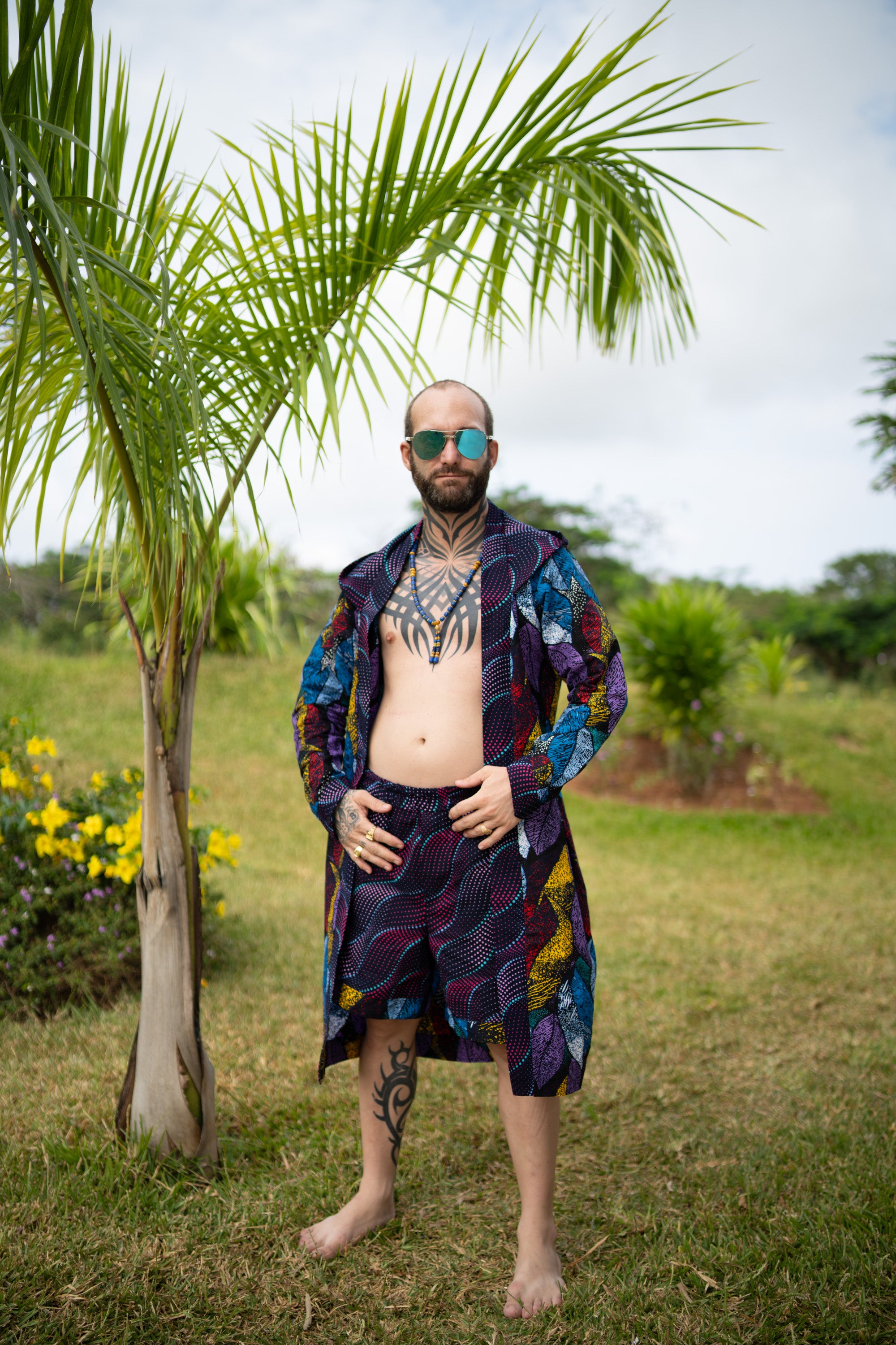 Man in Midnight Garden African cover-up and shorts with bold midnight floral design
