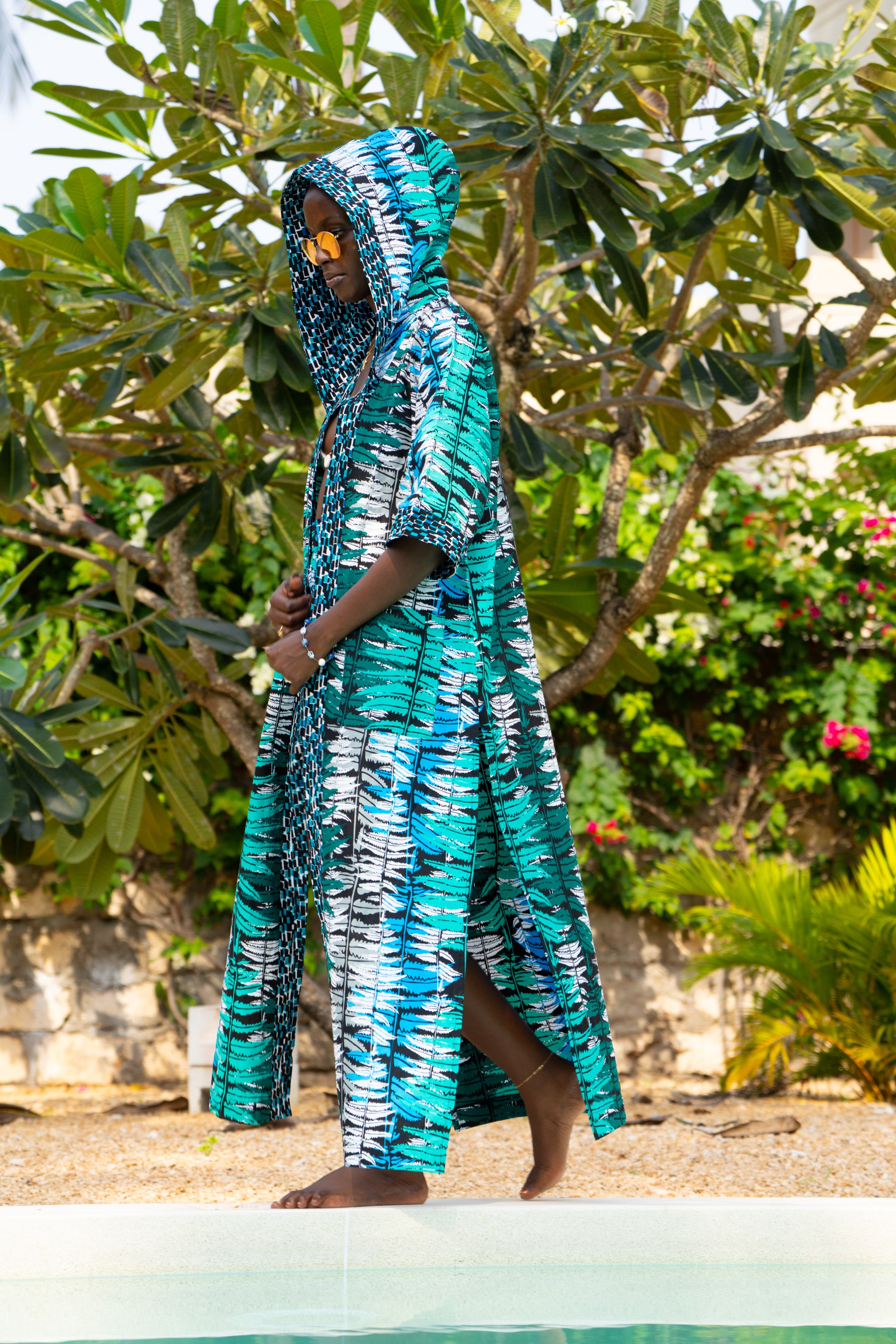 Ocean Teal African cover-up in cool teal tones worn by a woman