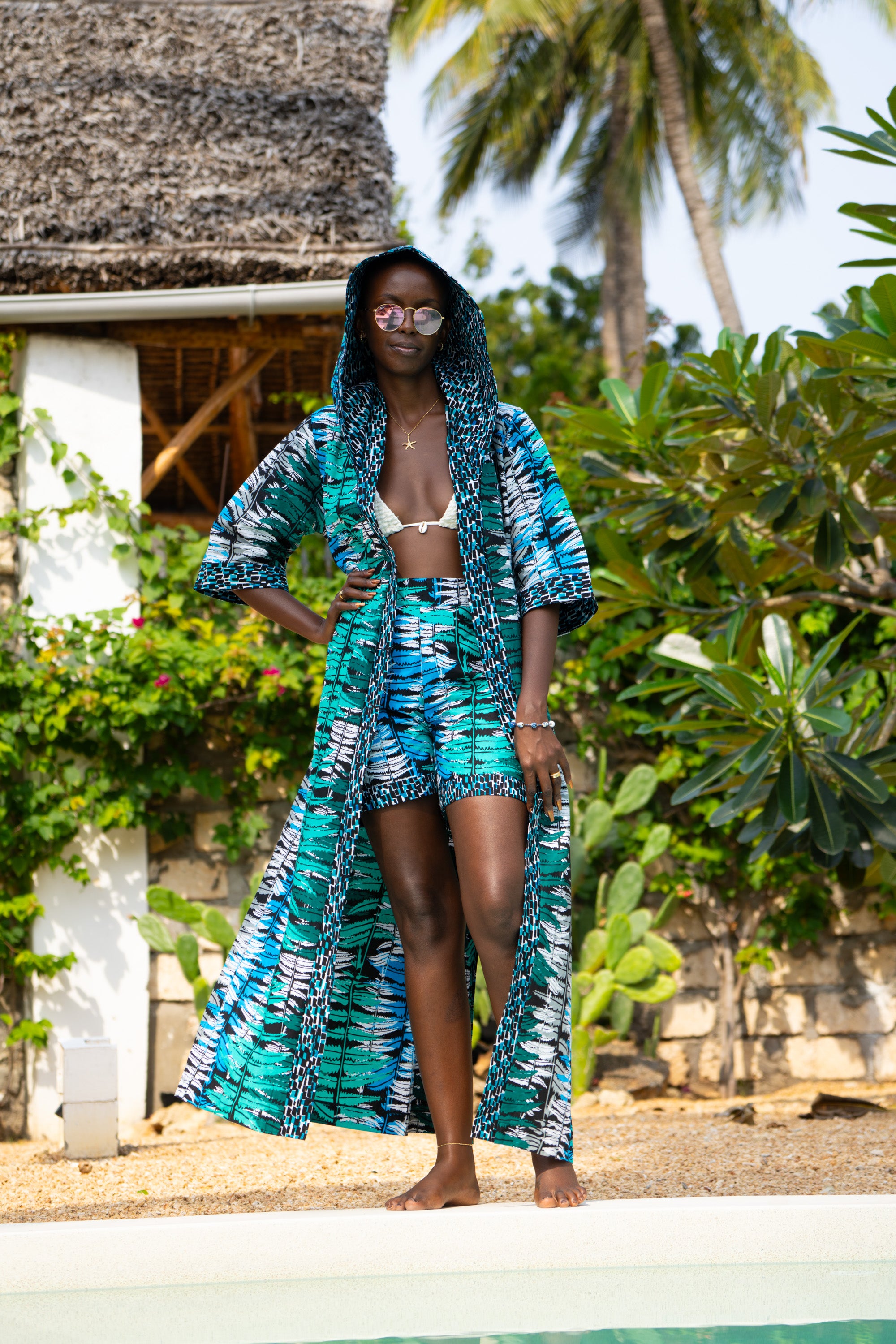Ocean Teal African cover-up in cool teal tones worn by a woman