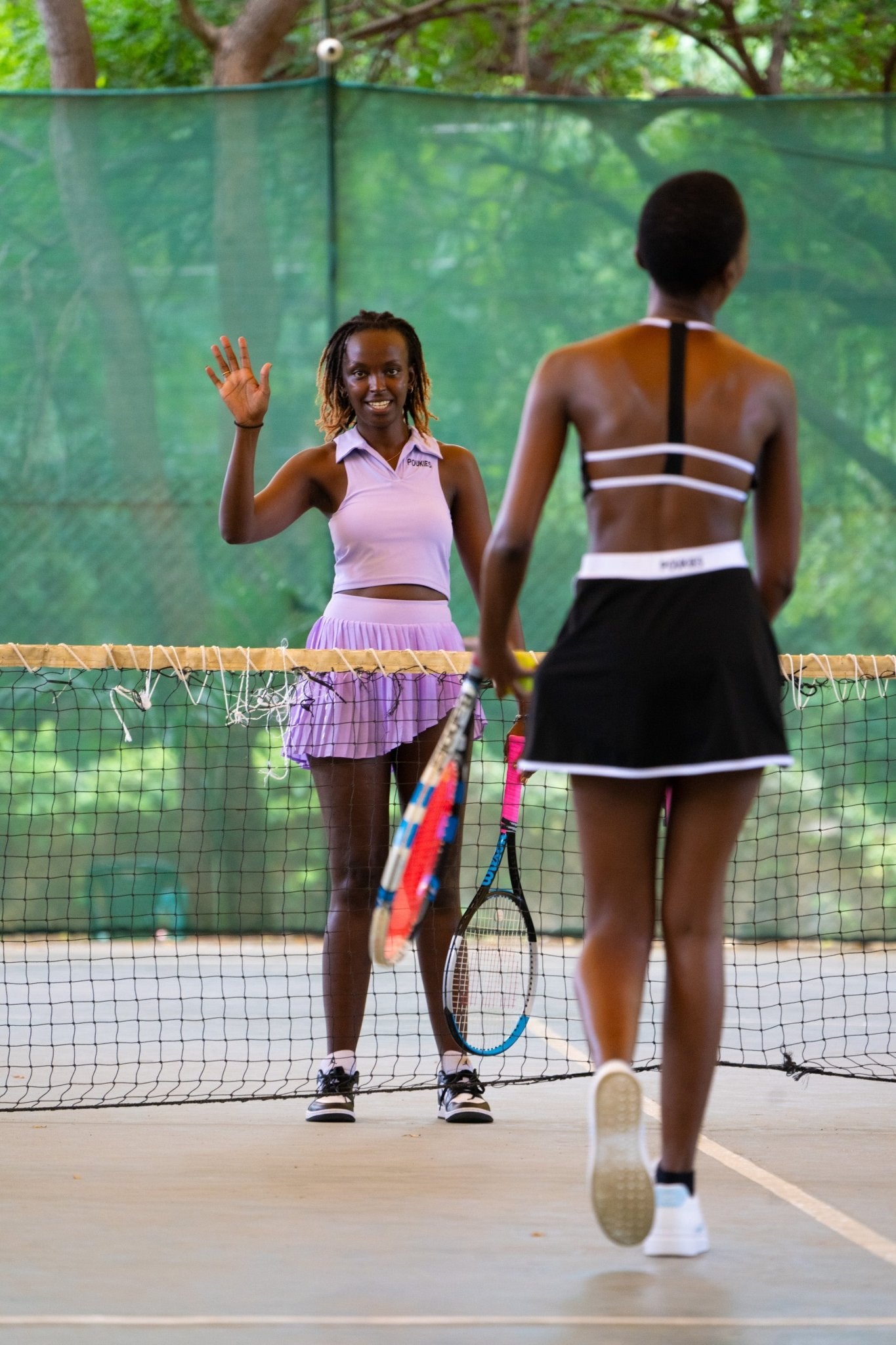 Poukies purple tennis set for couples; matching activewear top and bottoms, bold resort and gym look, Zawadi Hat Fashion