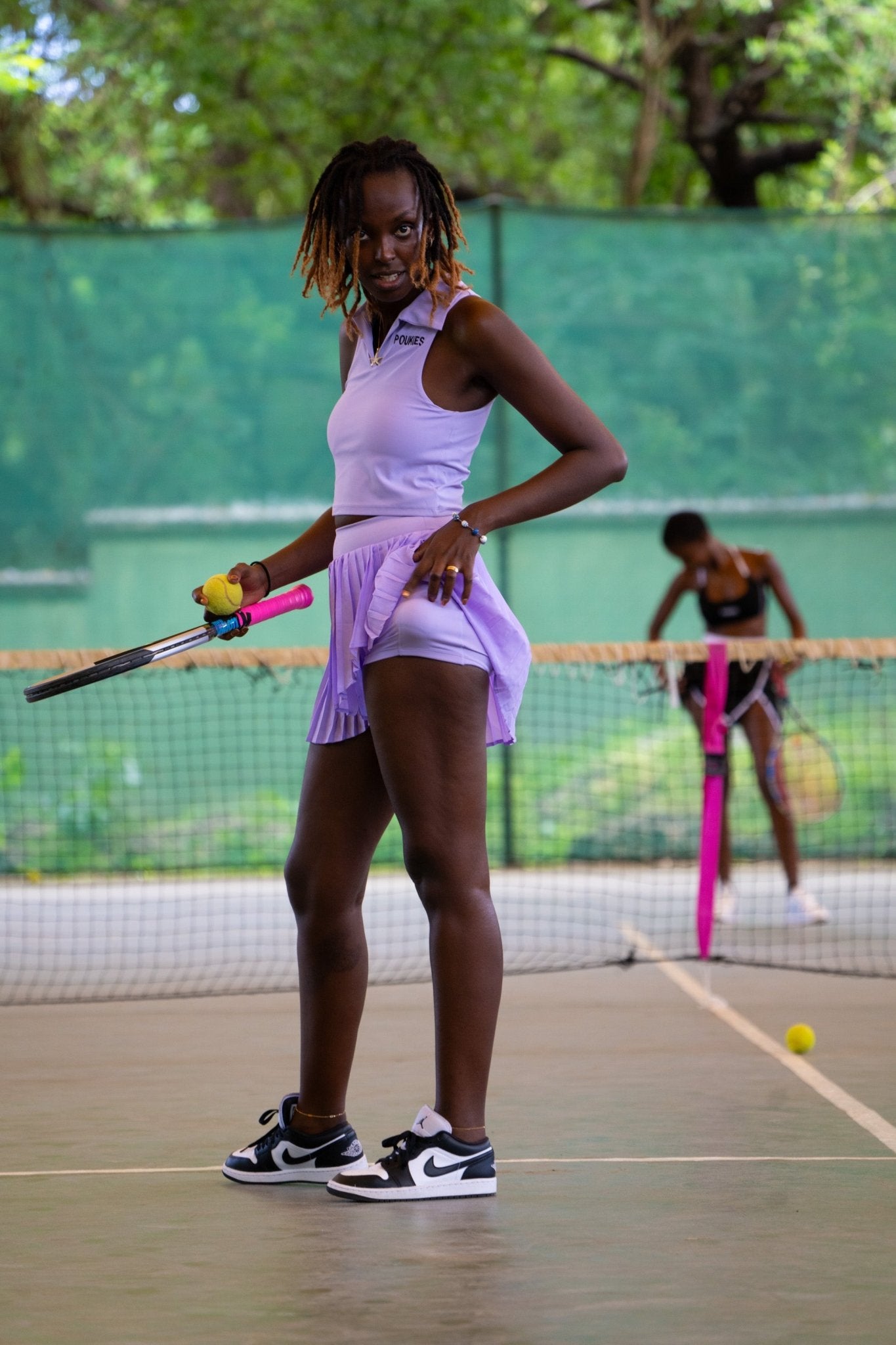 Poukies purple tennis set for couples; matching activewear top and bottoms, bold resort and gym look, Zawadi Hat Fashion