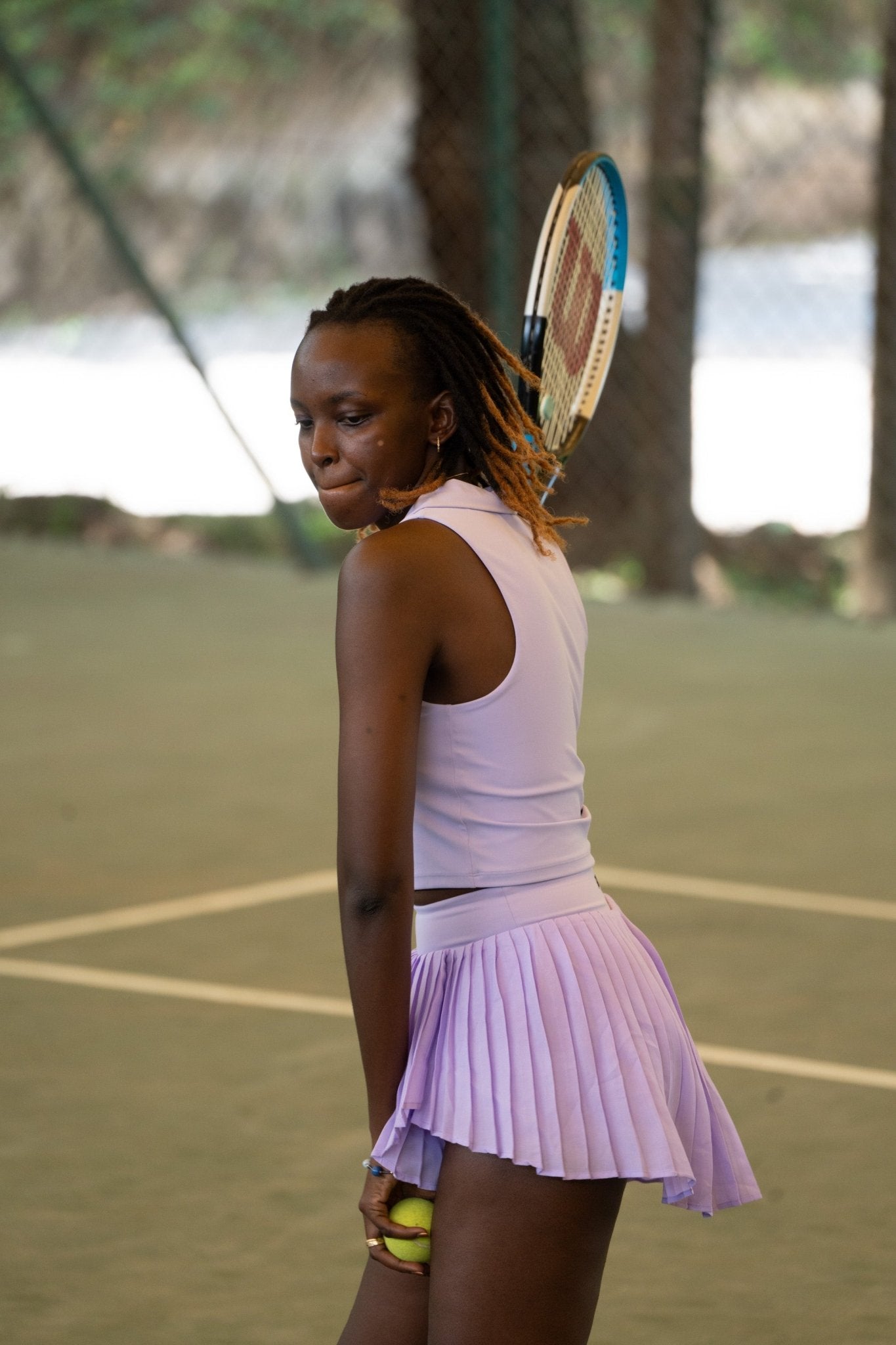 Poukies purple tennis set for couples; matching activewear top and bottoms, bold resort and gym look, Zawadi Hat Fashion