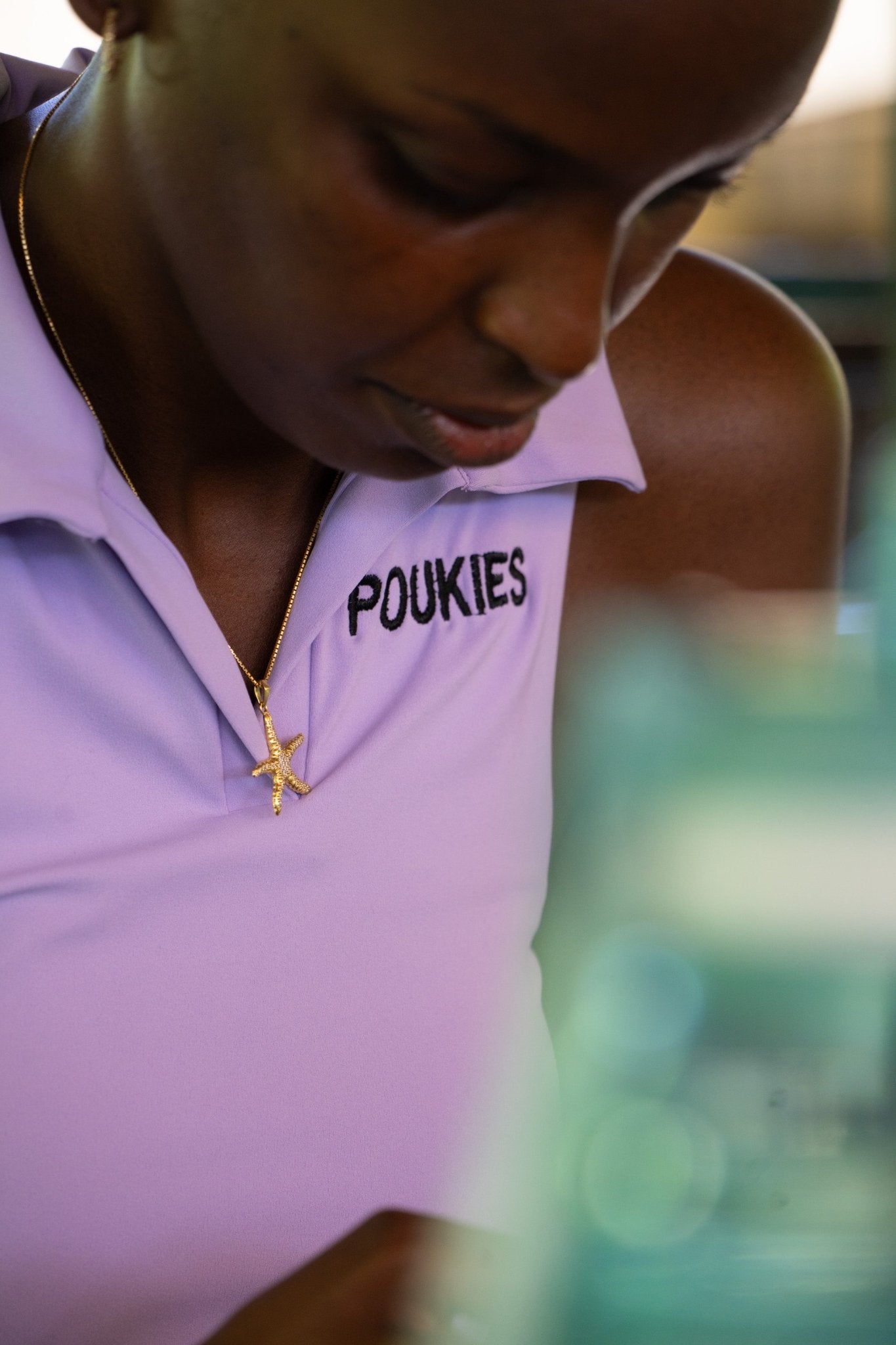 Poukies purple tennis set for couples; matching activewear top and bottoms, bold resort and gym look, Zawadi Hat Fashion