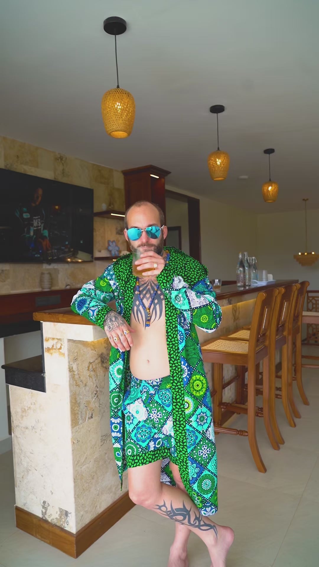 A video of an interracial couple showing a matching clothing set fit for summer wear.