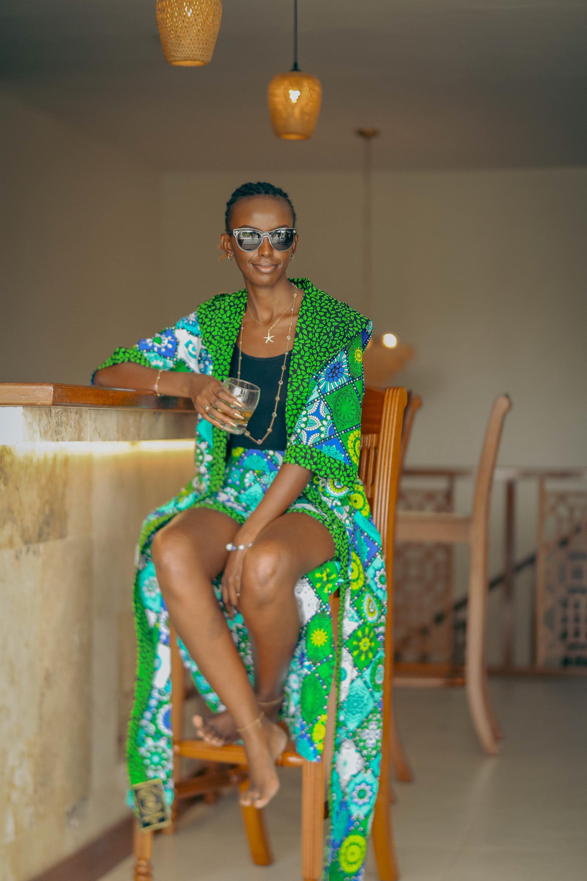 Woman in Mandala Bloom African cover-up and shorts set with bold mandala-inspired pattern