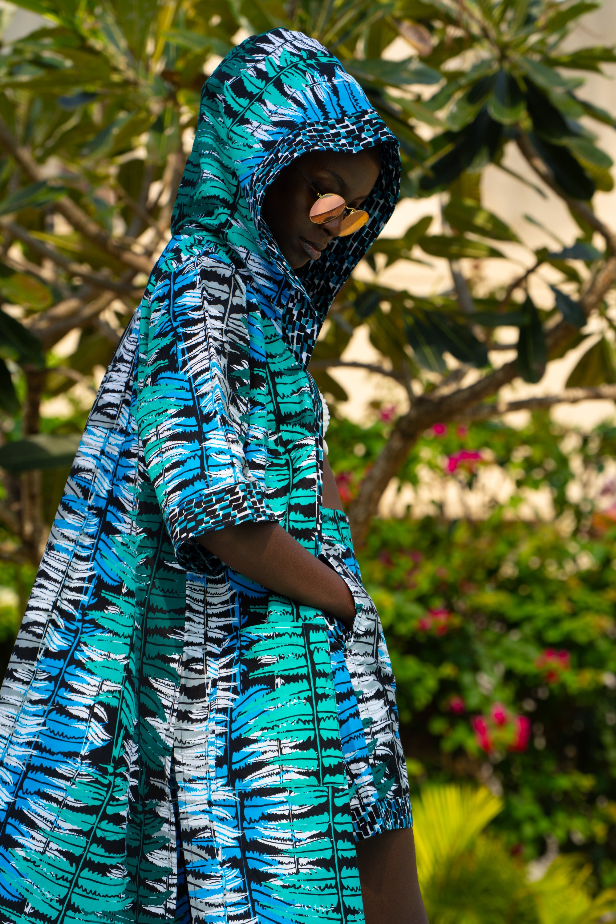 Ocean Teal African cover-up in cool teal tones worn by a woman