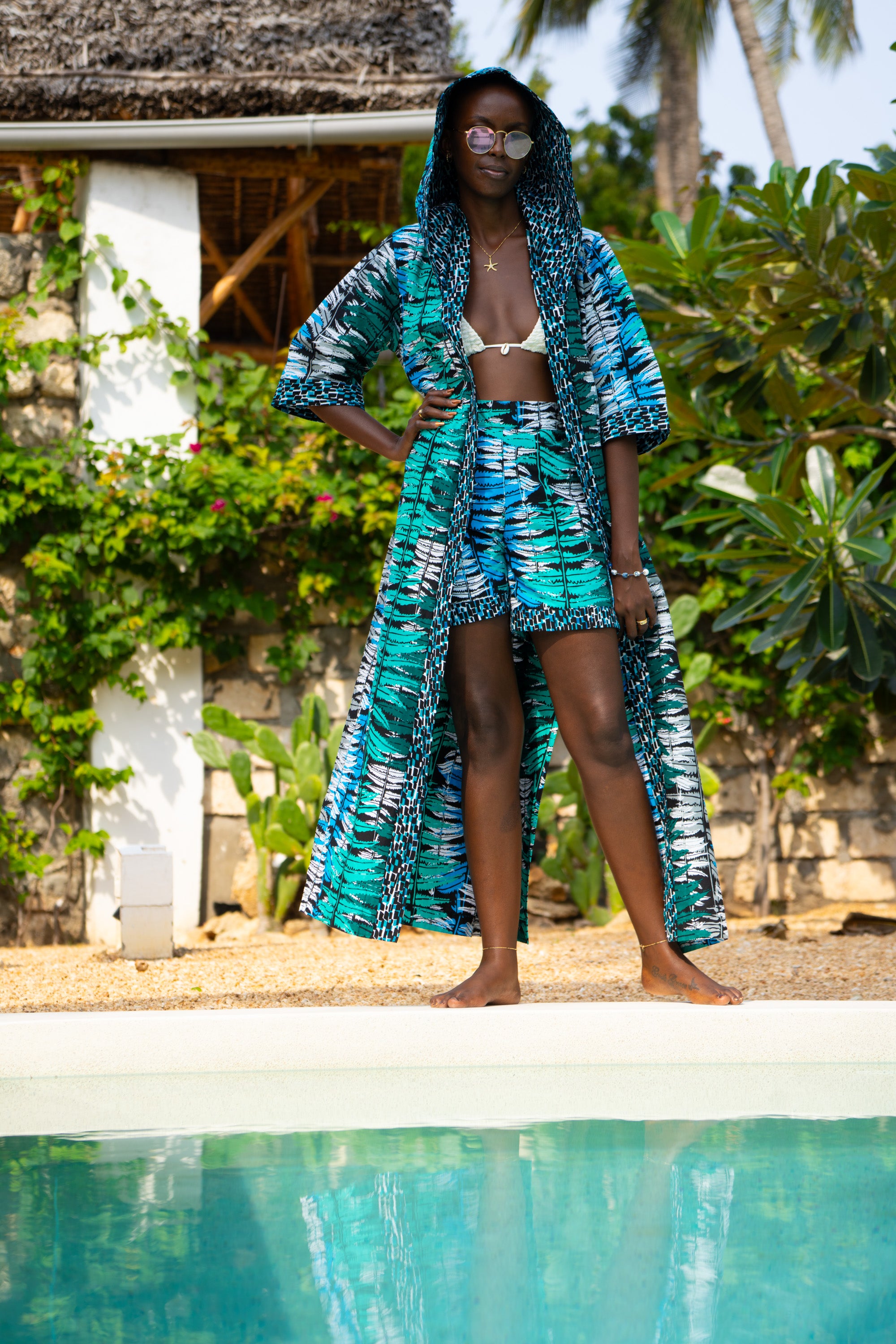 Ocean Teal African cover-up in cool teal tones worn by a woman