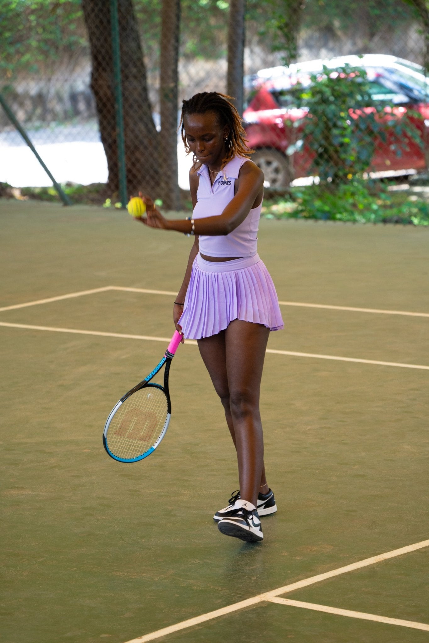 Poukies purple tennis set for couples; matching activewear top and bottoms, bold resort and gym look, Zawadi Hat Fashion
