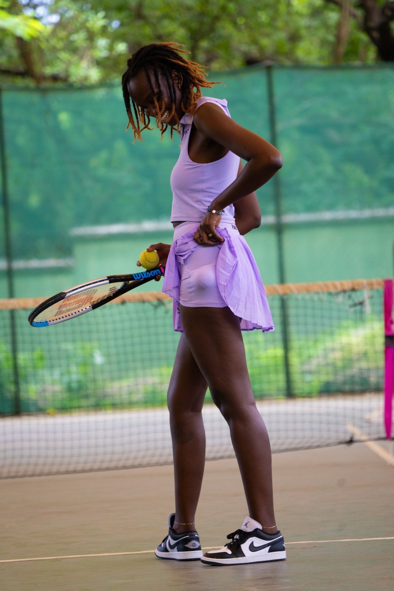 Poukies purple tennis set for couples; matching activewear top and bottoms, bold resort and gym look, Zawadi Hat Fashion