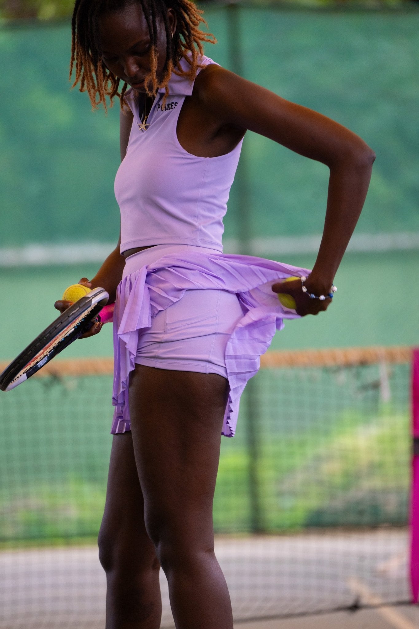 Poukies purple tennis set for couples; matching activewear top and bottoms, bold resort and gym look, Zawadi Hat Fashion