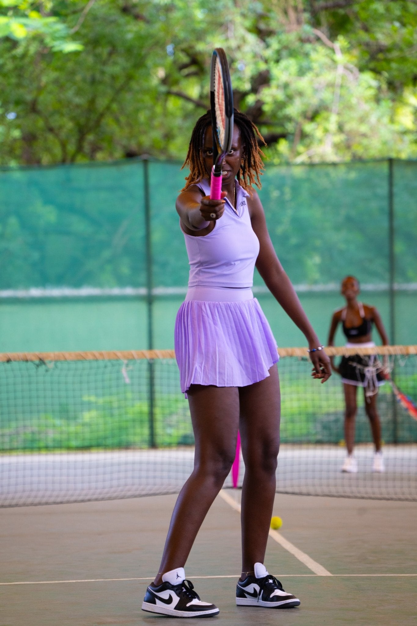 Poukies purple tennis set for couples; matching activewear top and bottoms, bold resort and gym look, Zawadi Hat Fashion