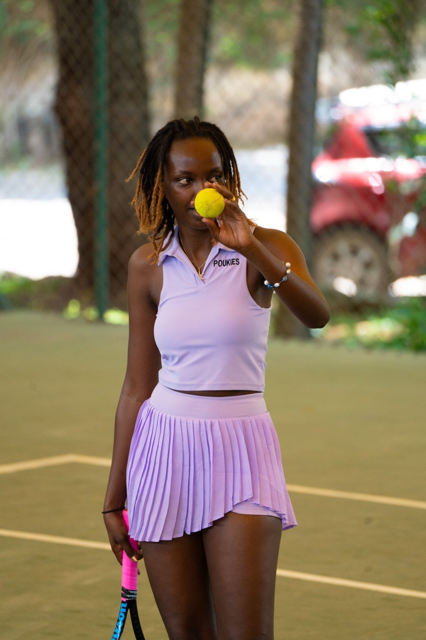 Poukies purple tennis set for couples; matching activewear top and bottoms, bold resort and gym look, Zawadi Hat Fashion