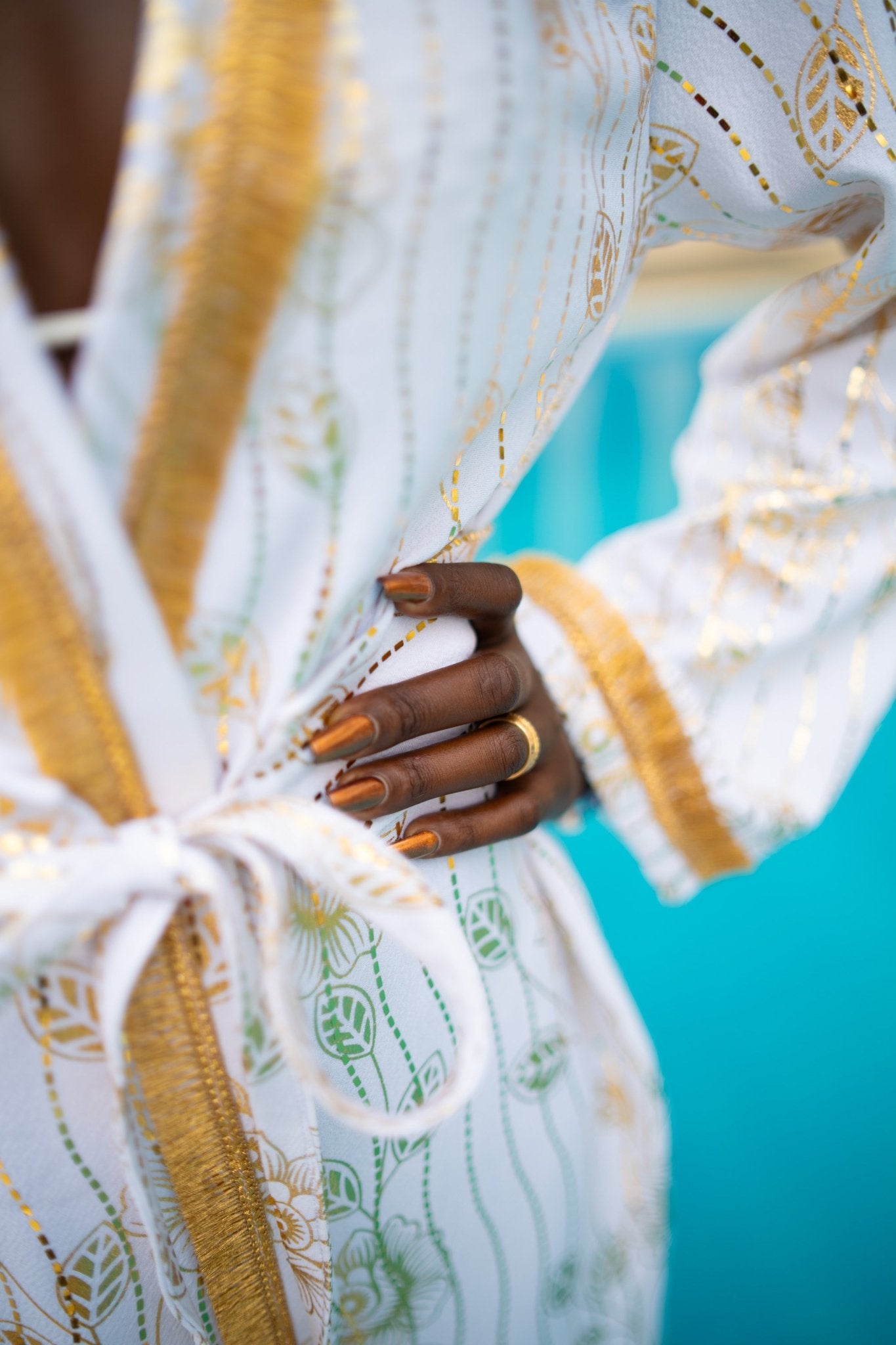 White and gold kimono cover-up with gol trim and removable belt; luxury resort, festival and party outfit, handmade in Kenya