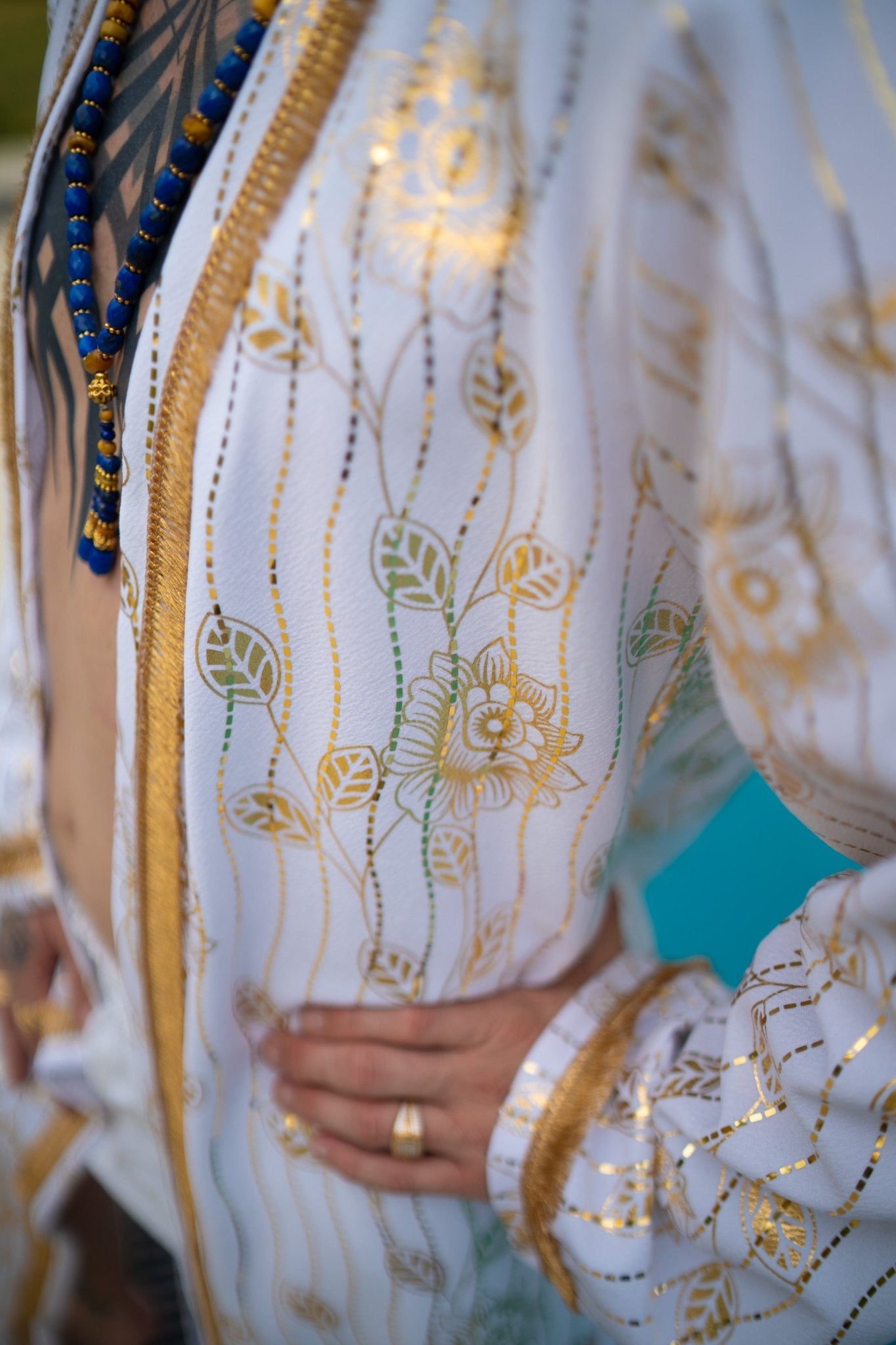 White and gold kimono cover-up with gol trim and removable belt; luxury resort, festival and party outfit, handmade in Kenya